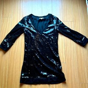 Black sequin cocktail dress with pockets